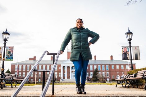Dr. Wendy Williams stands on top of stairs near Boyden Hall
