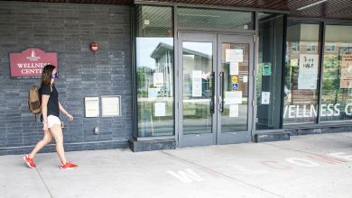 a student walks outside of wellness center