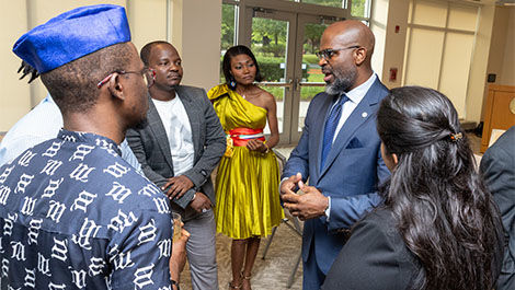 Travis Adkins speaks with a group of Mandela fellows.