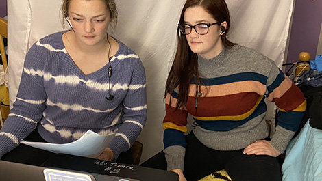 Emily and Erin O'Donnell rehearse in their home.