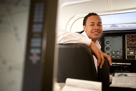 person using flight simulator