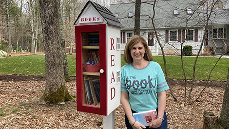 Dr. Marlene Correia with her little free library