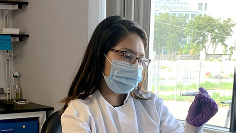 Susana Romero helps with testing.