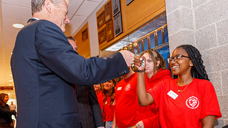 Gov. Baker fist bumps a BSU student.