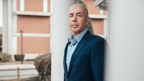Rob Cozzone poses for a photo on campus.