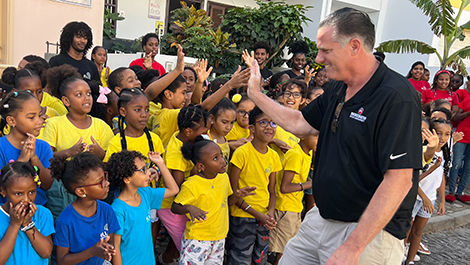 BSU President Fred Clark high-fives a group of ELL CV students.