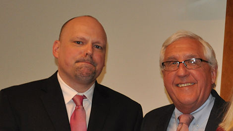 Brian Frederick and Michael Kryzanek stand for a photo.