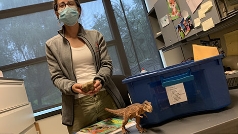 Jessica Campbell in her office with one of the GeoExplorers kits