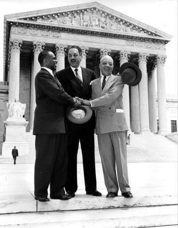 Lawyers George E.C. Hayes, Thurgood Marshall, and James M. Nabrit, Jr., celebrating outside the U.S. Supreme Court, Washington, D.C., after the Court ruled in Brown v. Board of Education that racial segregation in public schools was unconstitutional, May 17, 1954. AP Images