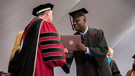 A student receives his diploma.