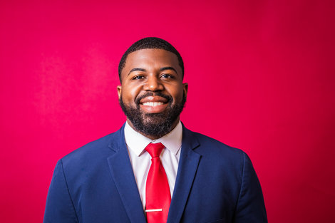 Photo of Joshua Joseph with red background