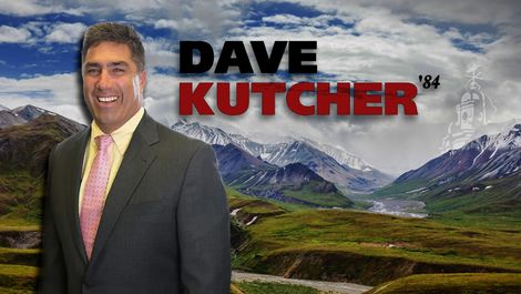Dave Kutcher wears a suit with alaskan background