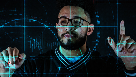 Omar Osman touches a clear screen with buttons and grid lines.