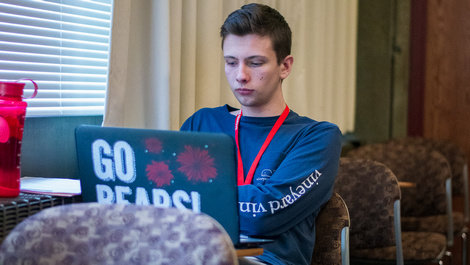 A student works on a computer.