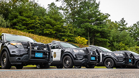 Three BSU police cars parked in a lot
