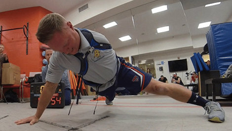 Greg Reynolds does a pushup.