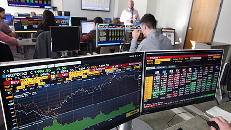 Students use special computers to access current financial information.
