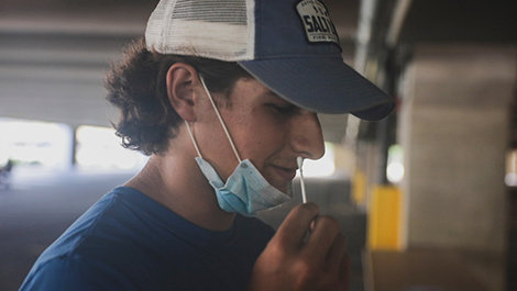 A student is tested for COVID-19.