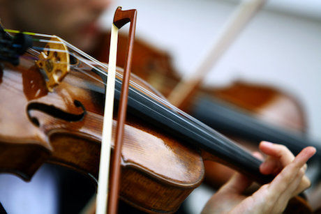 Close up of hands playing violin Close up of hands playing violin