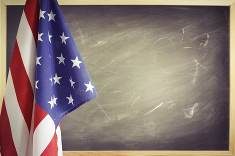 Stock photo of American flag in front of classroom chalkboar Stock photo of American flag in front of classroom chalkboar