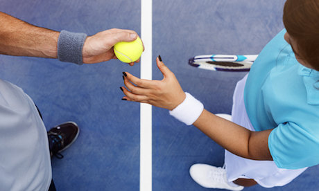 Tennis coach and student at net, shown from above Tennis coach and student at net, shown from above