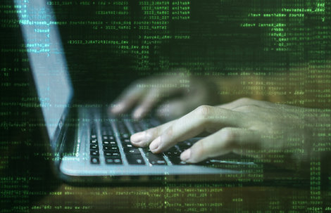 Photo illustration of a hacker’s hands on a laptop keyboard Photo illustration of a hacker’s hands on a laptop keyboard