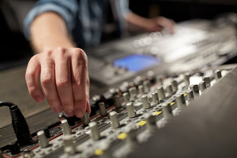A student working on a soundboard A student working on a soundboard