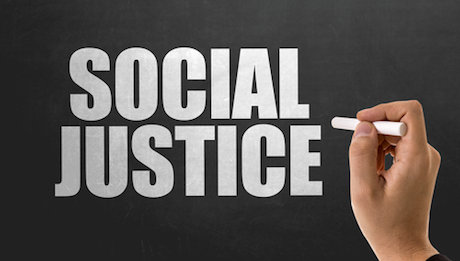 Social Justice written on a chalkboard Social Justice written on a chalkboard