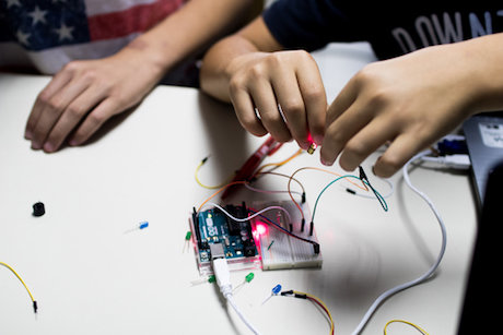 Students working on a project involving wiring Students working on a project involving wiring