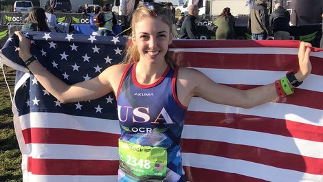 Lyndsey Kate Littlefield holds an American flag after a rece Lyndsey Kate Littlefield holds an American flag after a rece
