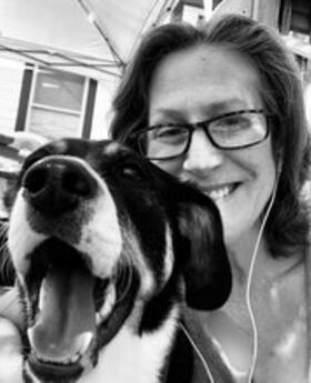 black and white photo of Lori LeComte and her dog