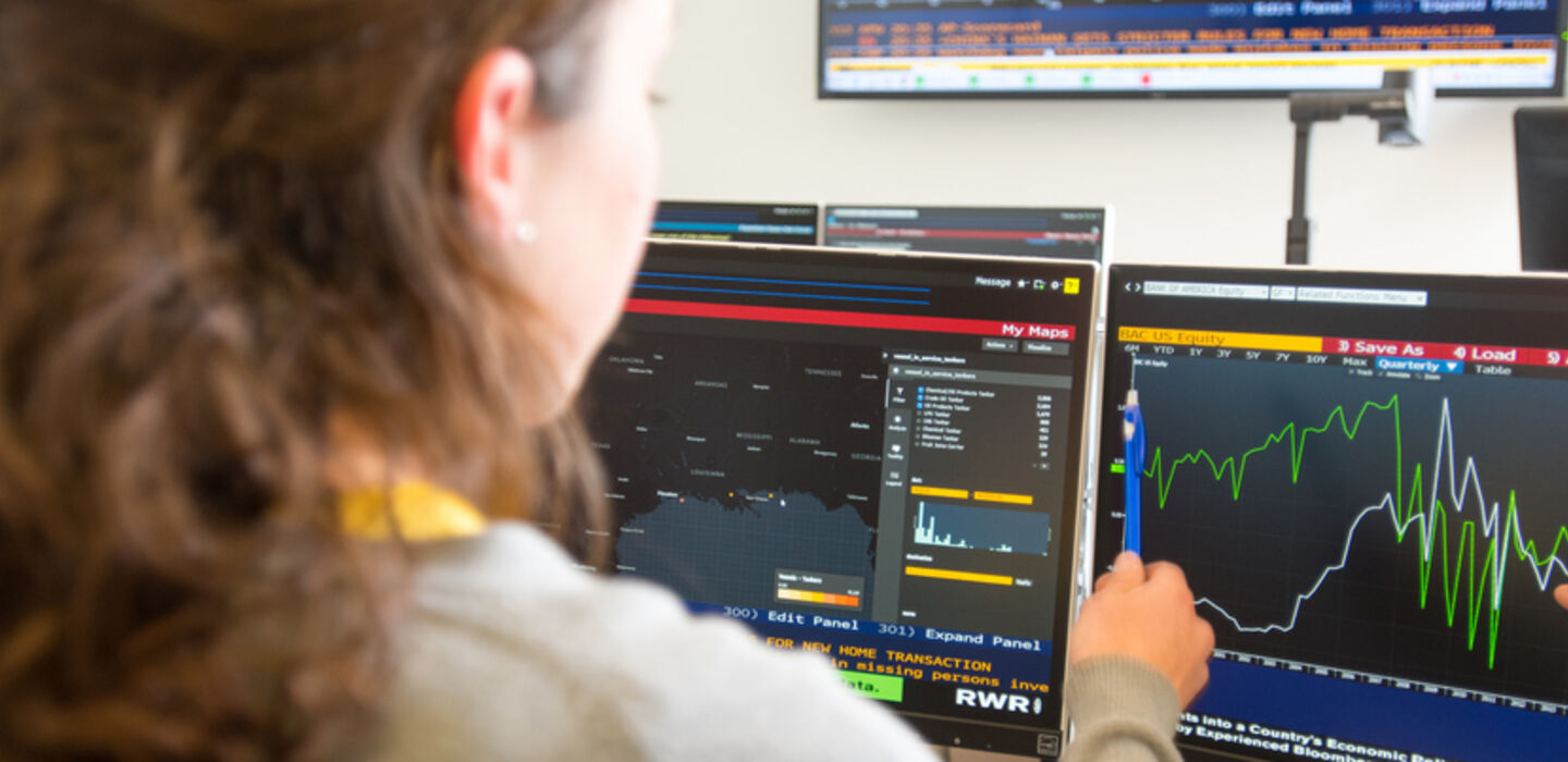 students working at Bloomberg terminals