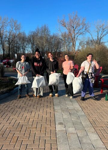 Members of the EAT club participating in a clean-up event in 2025